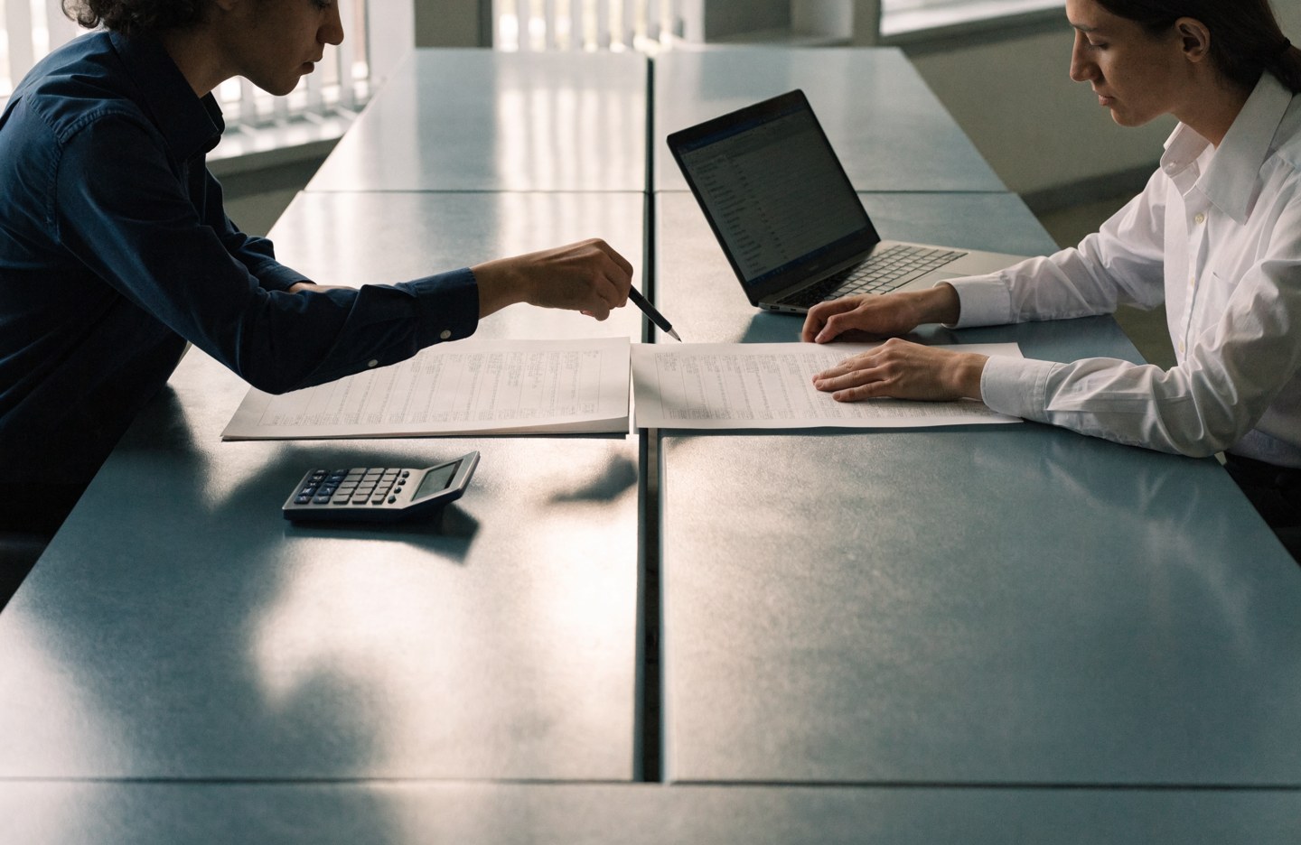 Financial analysts reviewing invoices and supporting documents